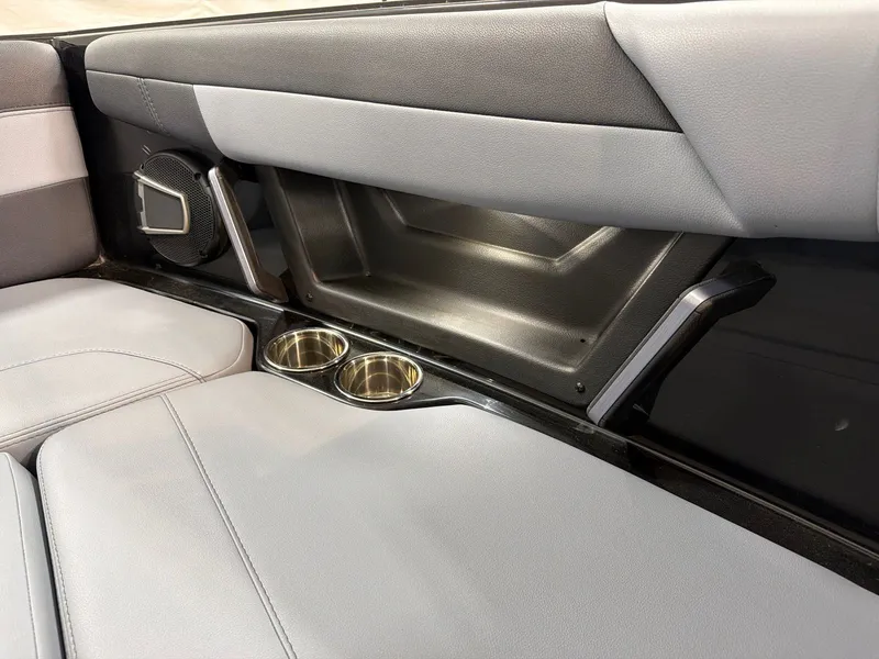 Slide: The Image of 2026 Axis T250 interior with speaker and cup holders. - 12