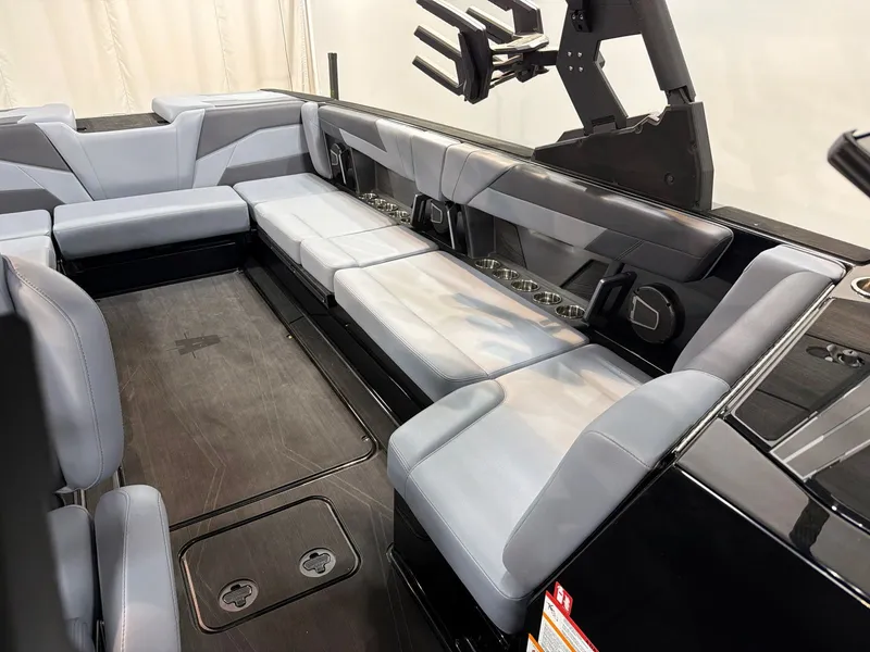 Slide: The Image of 2026 Axis T250 interior with gray seating and cup holders. - 13