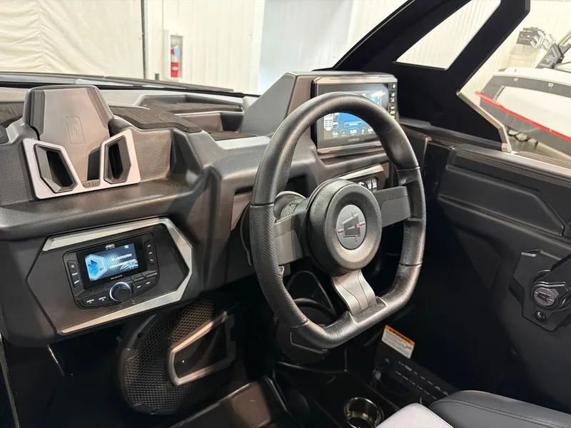 Slide: The Image of Interior of 2026 Axis T250 featuring modern dashboard and steering wheel. - 16