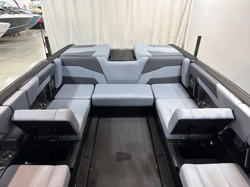 Slide: The Image of Interior of Axis T250 boat, 2026, featuring gray upholstered seating. - 19
