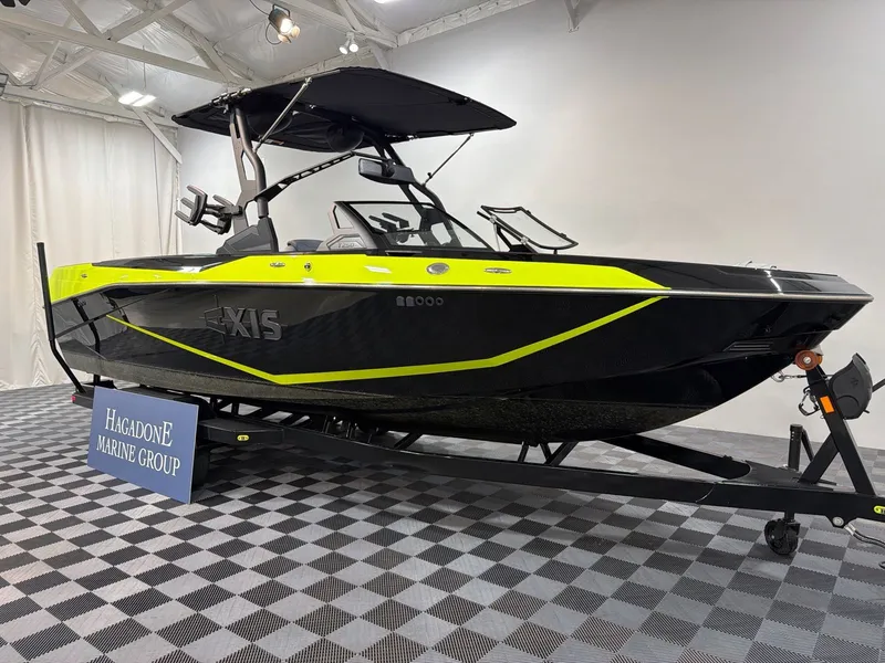 Slide: The Image of 2026 Axis T250 boat in showroom on trailer. - 2