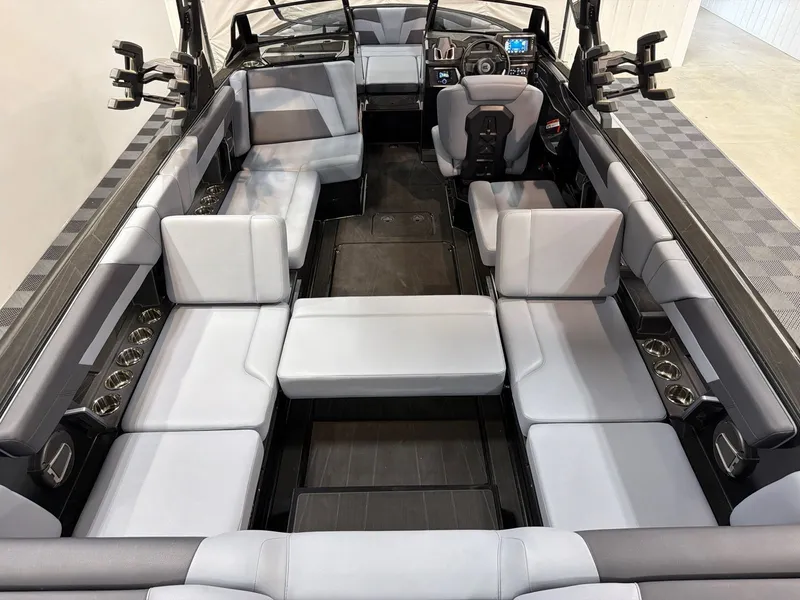 Slide: The Image of Interior of Axis T250 boat, 2026 model, featuring gray upholstery. - 21