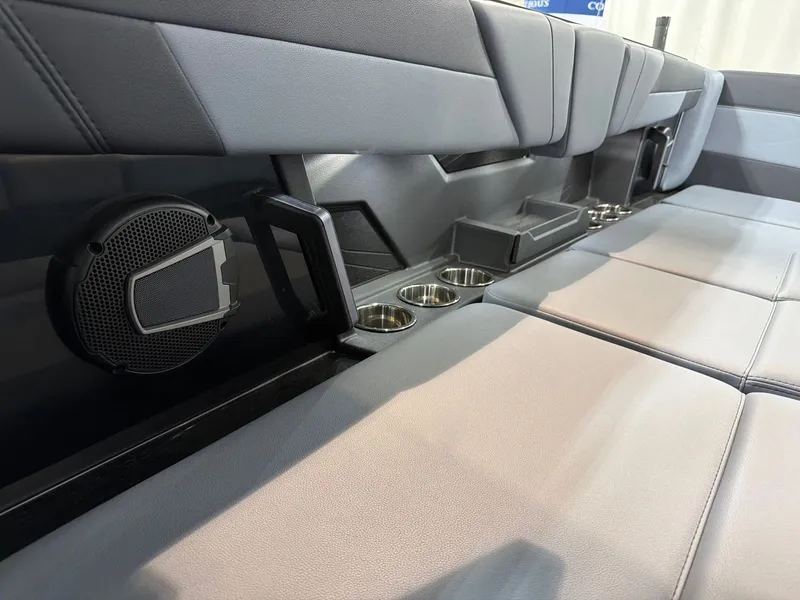 Slide: The Image of 2026 Axis T250 interior with speaker and cup holders. - 22
