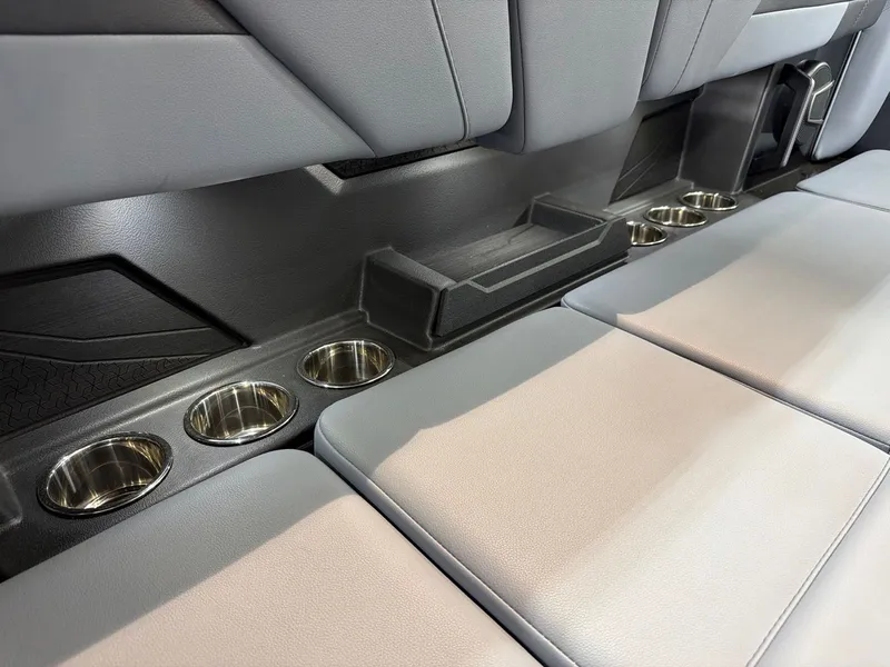 Slide: The Image of 2026 Axis T250 interior with cup holders. - 23