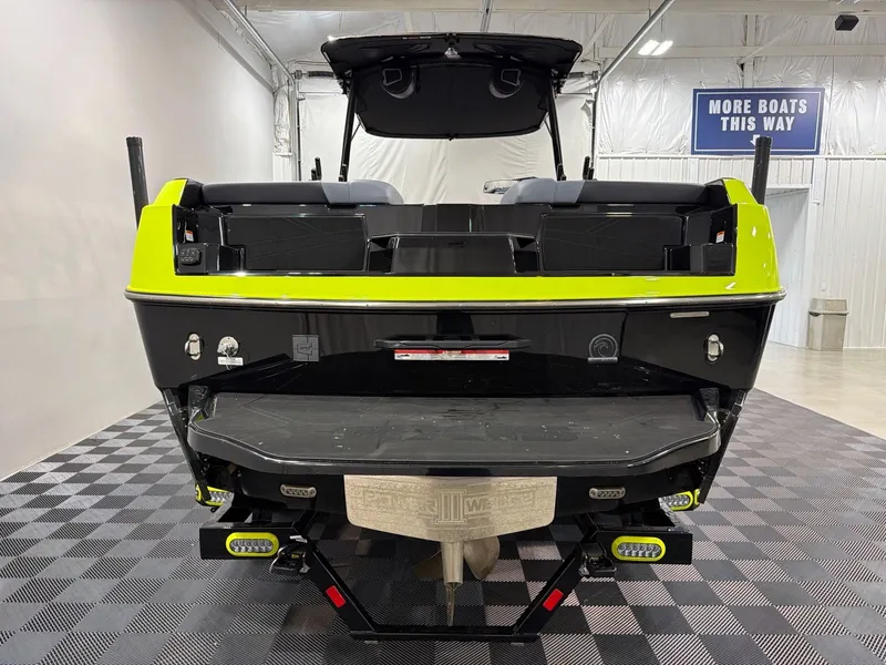 Slide: The Image of Rear view of a 2026 Axis T250 boat in a showroom. - 4