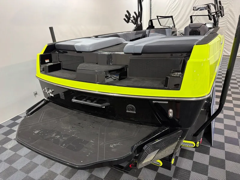 Slide: The Image of Axis T250 2026 boat with bright yellow rear and gray seating. - 5