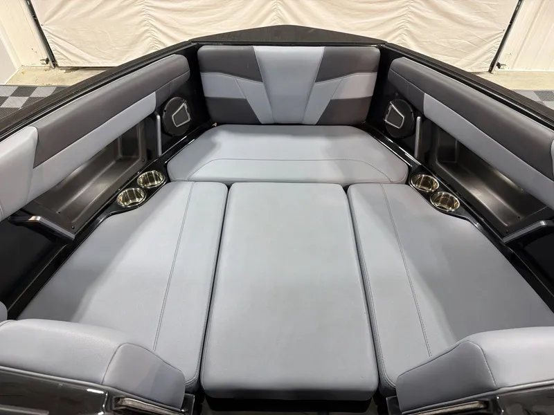 Slide: The Image of Interior of 2026 Axis T250 boat with gray upholstery and cup holders. - 9