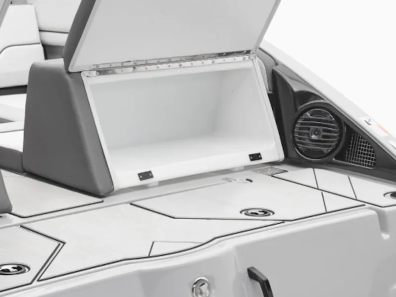 Slide: The Image of Yamaha Boats 252XE 2026, open storage compartment and speaker. - 2