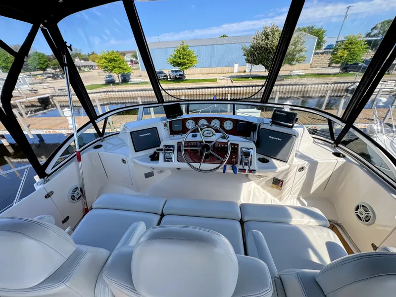 Slide: The Image of Interior view of 2002 Silverton 39 Motor Yacht helm with instruments. - 11