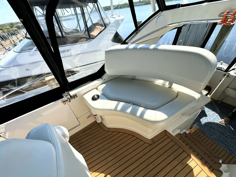 Slide: The Image of Interior of 2002 Silverton 39 Motor Yacht with white seating. - 16
