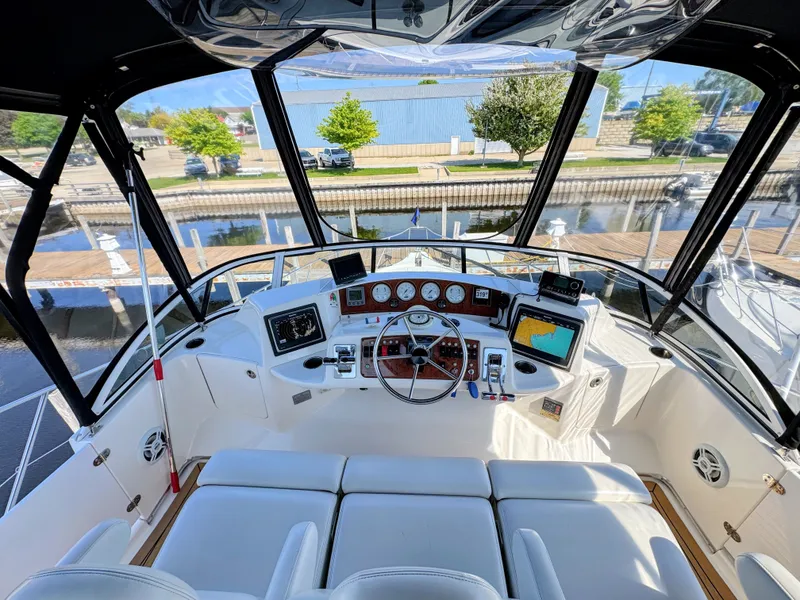 Slide: The Image of Interior view of 2002 Silverton 39 Motor Yacht helm with instruments. - 19