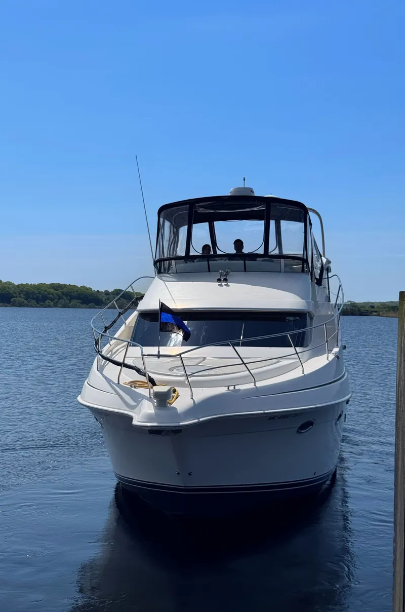 Slide: The Image of 2002 Silverton 39 Motor Yacht on calm water. - 2