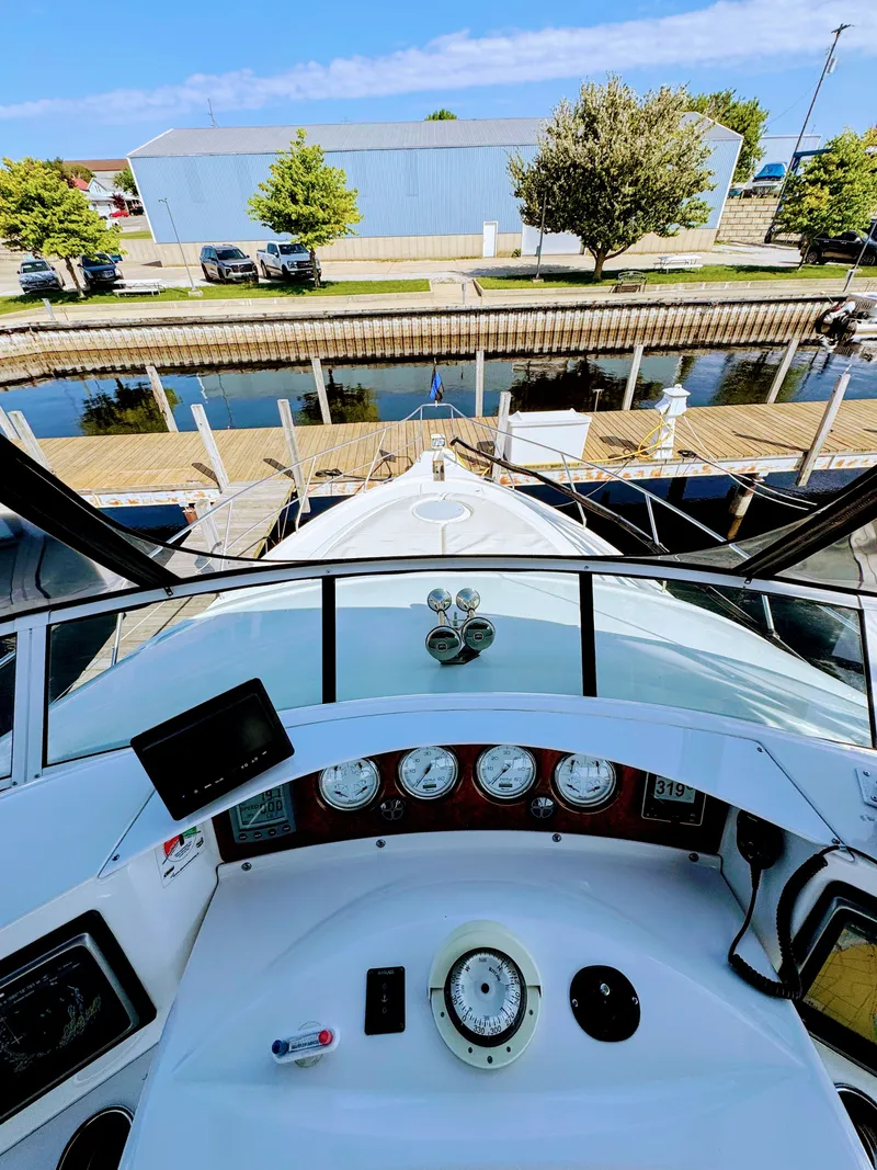 Slide: The Image of Cockpit view of 2002 Silverton 39 Motor Yacht docked in harbor. - 20