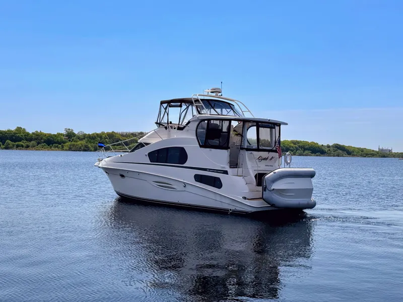 Slide: The Image of 2002 Silverton 39 Motor Yacht on calm water. - 3