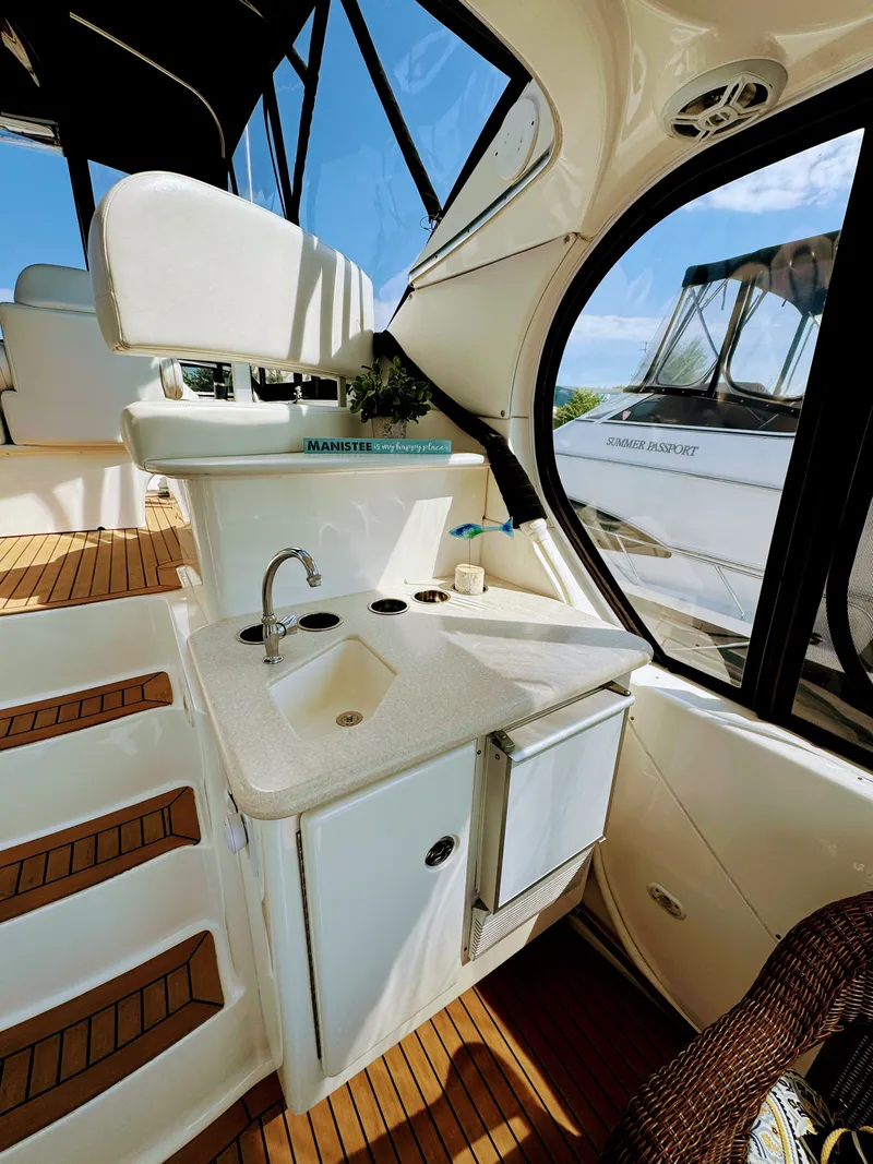 Slide: The Image of Interior of 2002 Silverton 39 Motor Yacht with sink and seating area. - 30