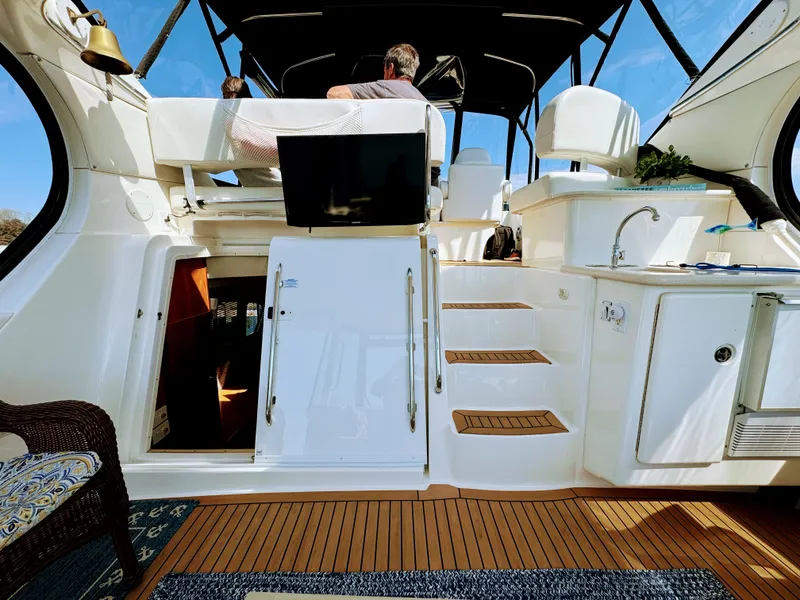Slide: The Image of Interior of a 2002 Silverton 39 Motor Yacht with stairs and seating area. - 31