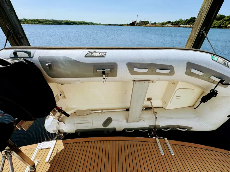Slide: The Image of 2002 Silverton 39 Motor Yacht with dinghy on the water. - 39