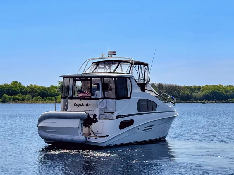 Slide: The Image of 2002 Silverton 39 Motor Yacht on calm water. - 4