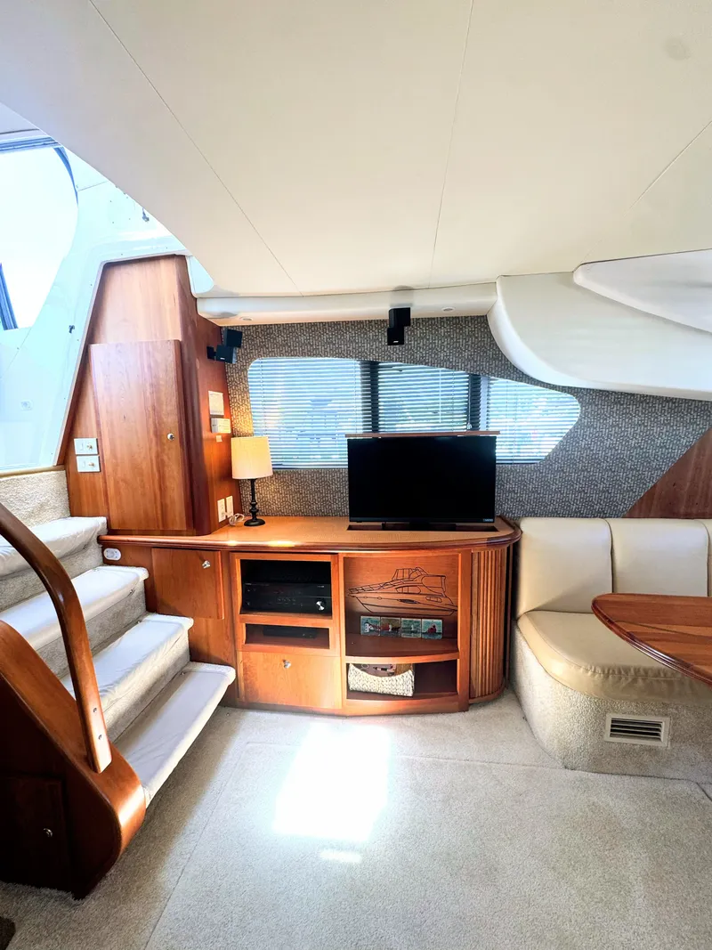 Slide: The Image of Interior of 2002 Silverton 39 Motor Yacht with TV and stairs. - 46