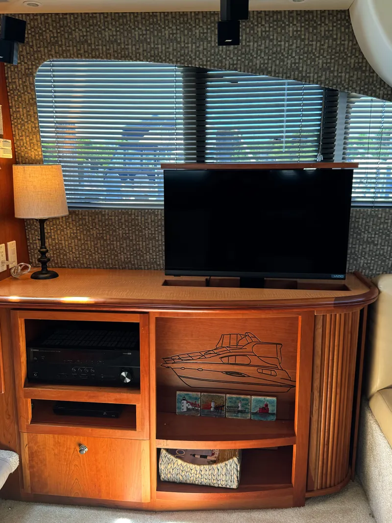 Slide: The Image of Interior of 2002 Silverton 39 Motor Yacht with TV and wooden cabinet. - 47