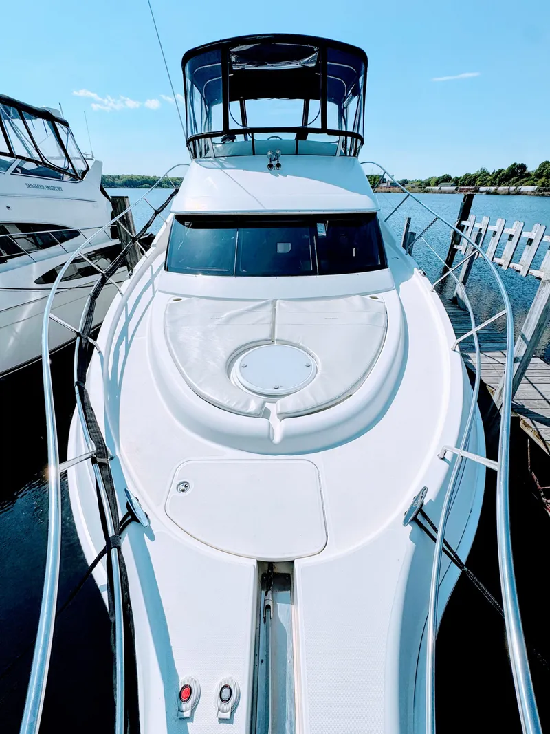 Slide: The Image of 2002 Silverton 39 Motor Yacht docked on a sunny day. - 6