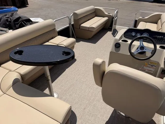 Slide: The Image of Interior of 2023 Montego Bay Pontoons C8520 DLX with beige seating. - 16