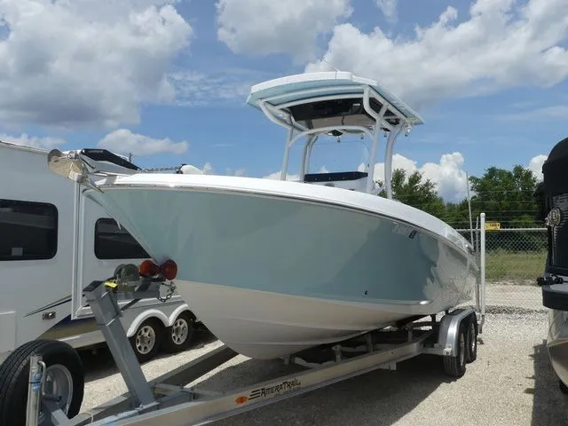 The Image of 2023 Wellcraft 222 Fisherman boat on trailer, blue sky. - 1