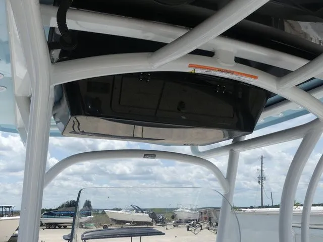 Slide: The Image of 2023 Wellcraft 222 Fisherman boat roof and sky. - 20