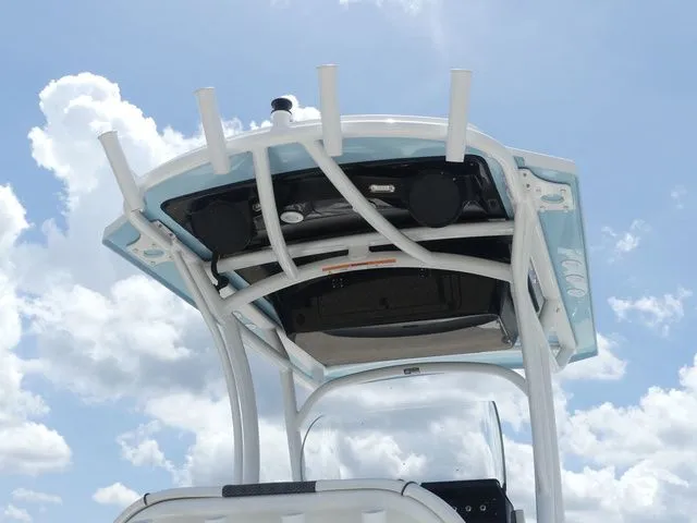 Slide: The Image of 2023 Wellcraft 222 Fisherman T-Top against blue sky. - 22