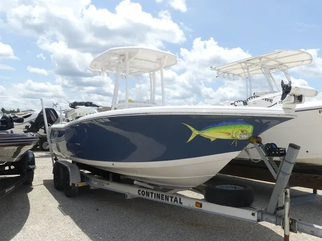 Slide: The Image of 2018 Tidewater 22 LXF boat on trailer, blue hull, fish graphic. - 3
