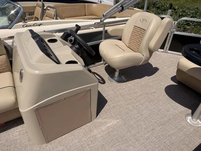 Slide: The Image of Interior of 2023 Montego Bay Pontoons C8520 DLX with beige seating. - 11