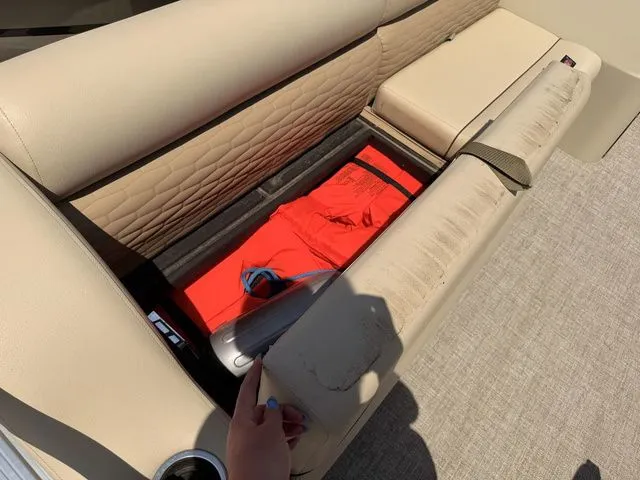 Slide: The Image of Montego Bay Pontoon 2023 seat storage with life jacket. - 6