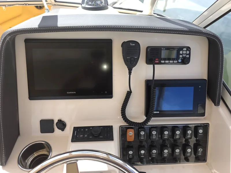 Slide: The Image of Dashboard of 2019 Grady-White Freedom 275 boat. - 11