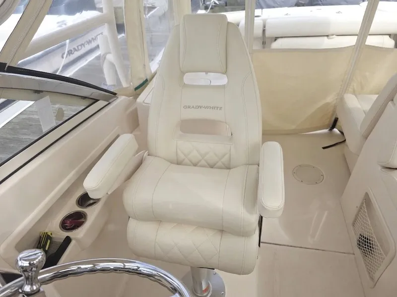 Slide: The Image of Interior of a 2019 Grady-White Freedom 275 boat with luxurious seating. - 14