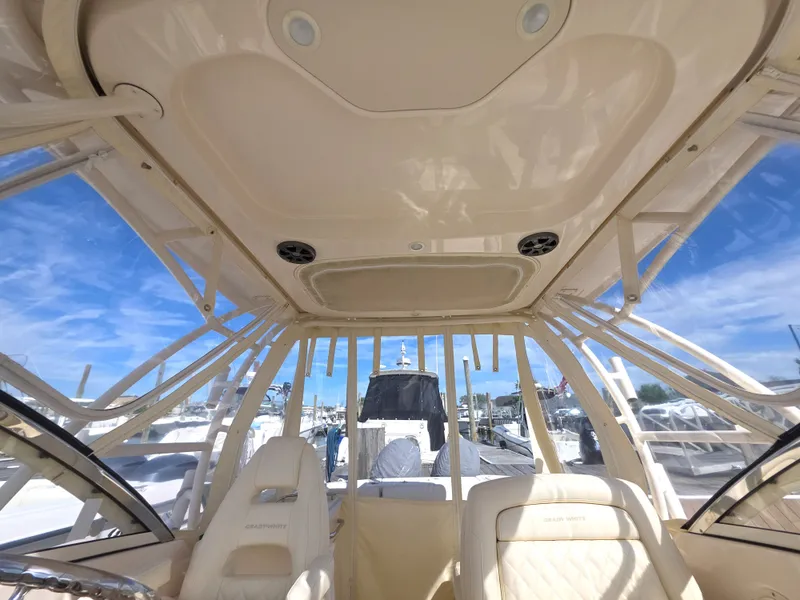 Slide: The Image of Interior view of a 2019 Grady-White Freedom 275 boat in harbor. - 18