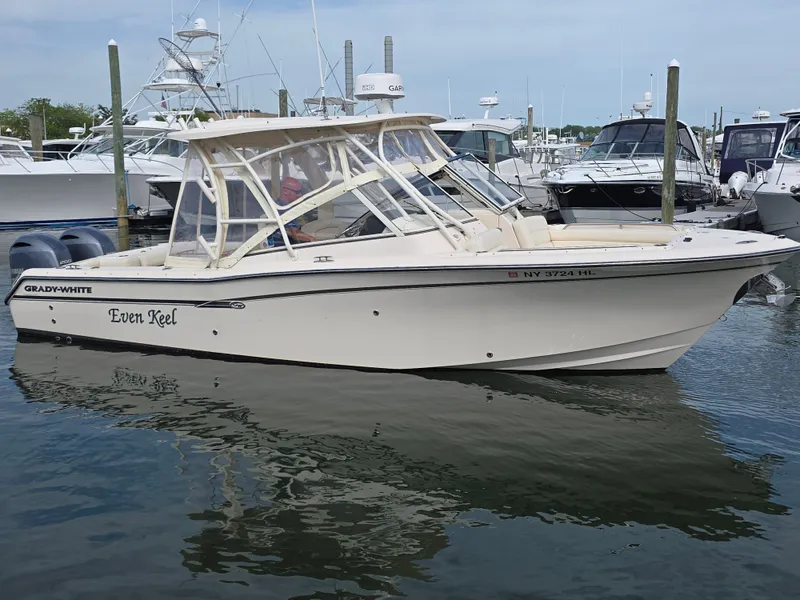 Slide: The Image of 2019 Grady-White Freedom 275 boat docked in marina. - 2