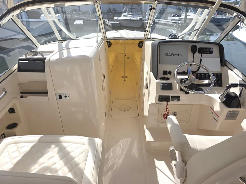 Slide: The Image of Interior of a 2019 Grady-White Freedom 275 boat with helm console. - 23
