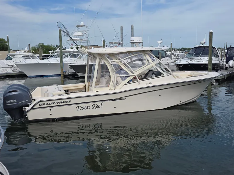 Slide: The Image of 2019 Grady-White Freedom 275 boat docked in marina. - 3