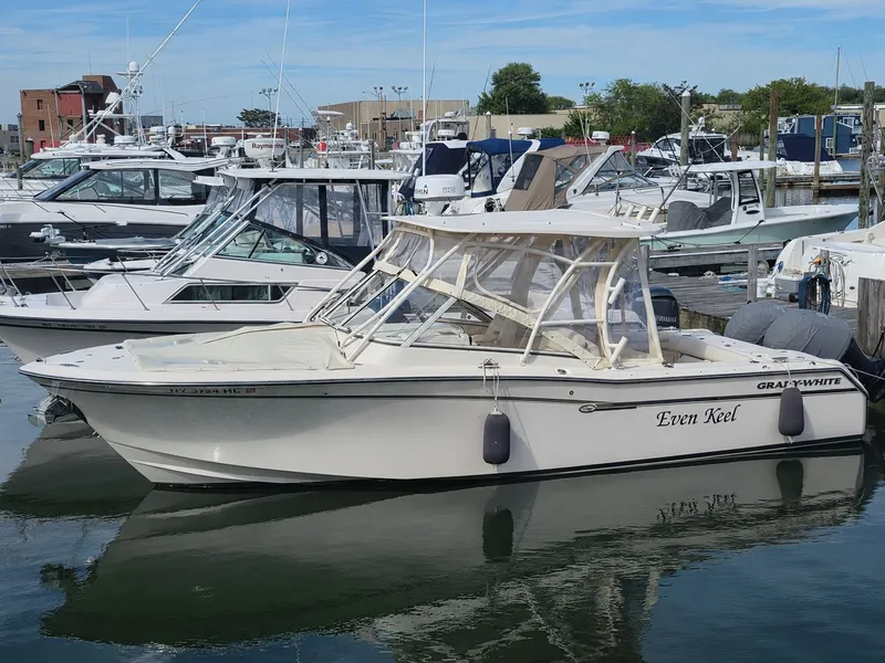 Slide: The Image of 2019 Grady-White Freedom 275 boat docked in marina. - 37