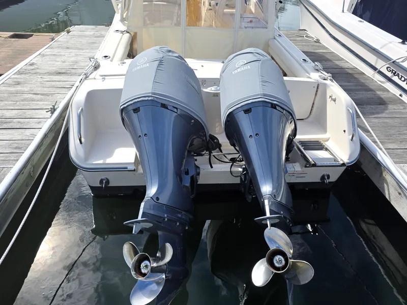 Slide: The Image of 2019 Grady-White Freedom 275 with Yamaha outboard motors at dock. - 4