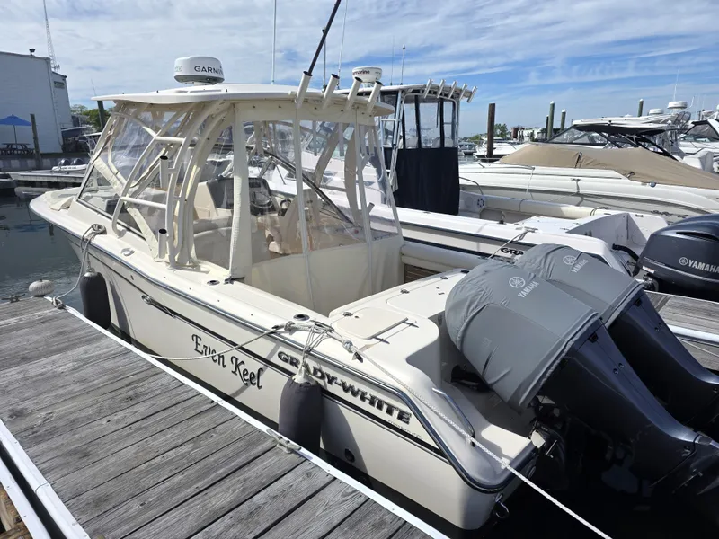Slide: The Image of 2019 Grady-White Freedom 275 boat docked at marina. - 9