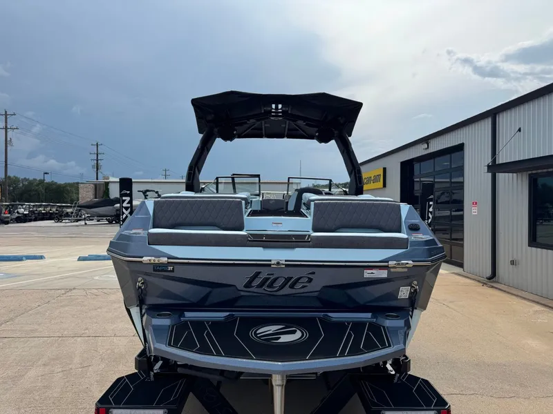 Slide: The Image of Rear view of 2026 Tigé Z3 boat on a parking lot. - 3