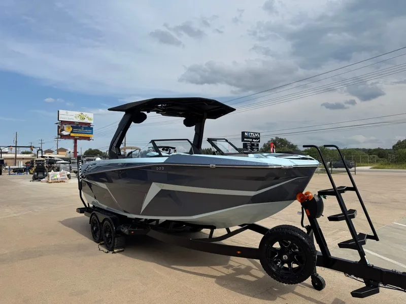 Slide: The Image of 2026 Tigé Z3 boat on trailer under cloudy sky. - 5