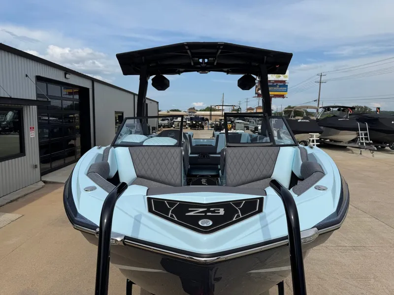 Slide: The Image of 2026 Tigé Z3 boat parked in front of a building. - 6