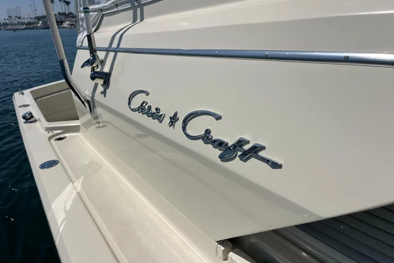 Slide: The Image of 1966 Chris-Craft 27 Commander boat, showcasing classic design and elegant branding. - 14