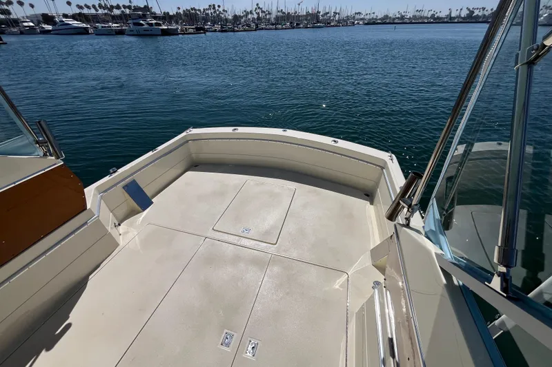 Slide: The Image of 1966 Chris-Craft 27 Commander boat deck with marina view in background. - 17