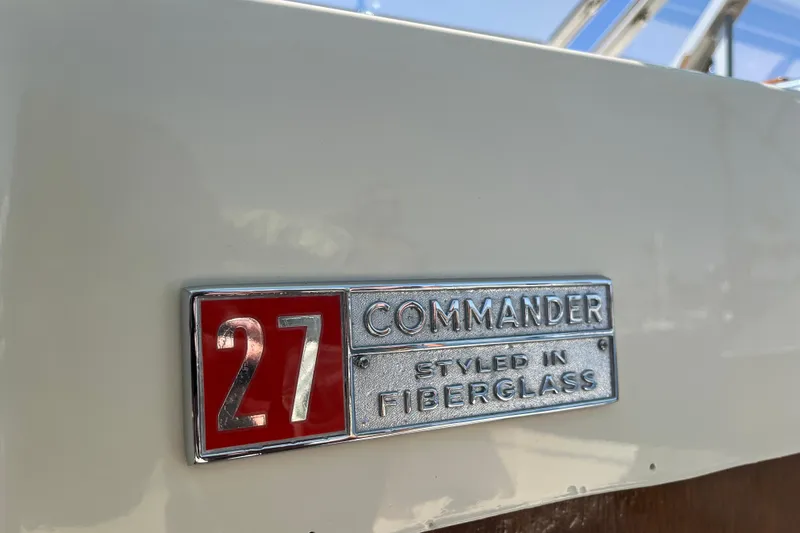 Slide: The Image of 1966 Chris-Craft 27 Commander badge, styled in fiberglass, close-up view. - 23