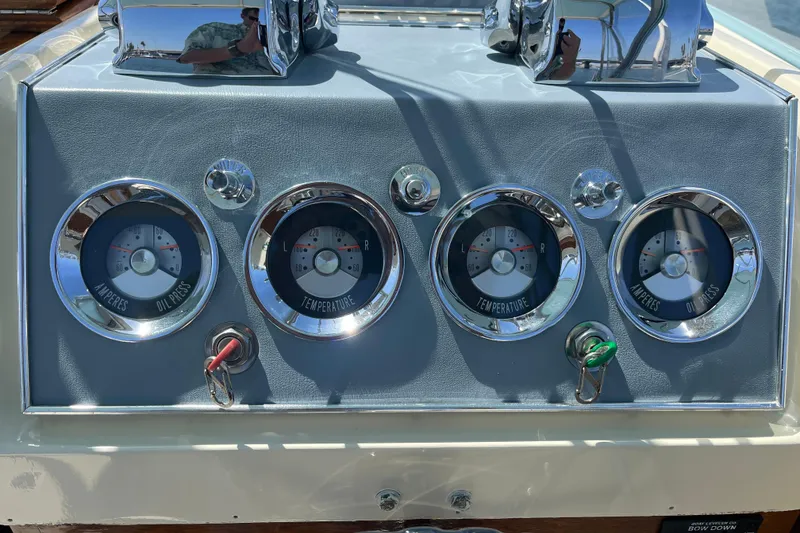 Slide: The Image of 1966 Chris-Craft 27 Commander dashboard with gauges for amperes, oil pressure, and temperature. - 26