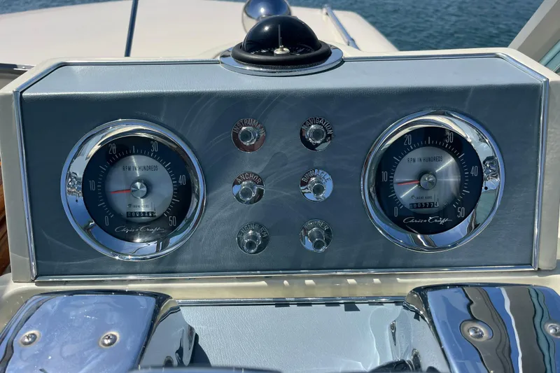 Slide: The Image of 1966 Chris-Craft 27 Commander dashboard with vintage gauges and controls. - 27