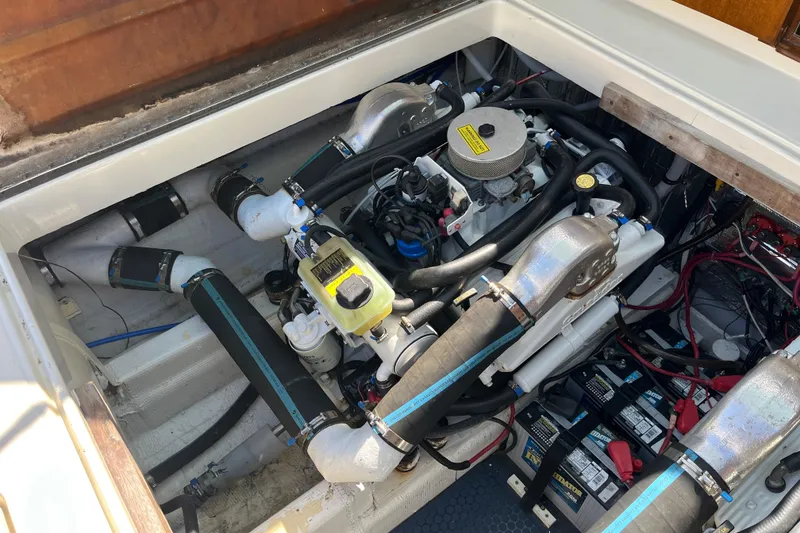 Slide: The Image of Engine compartment of a 1966 Chris-Craft 27 Commander boat, showcasing mechanical components. - 31